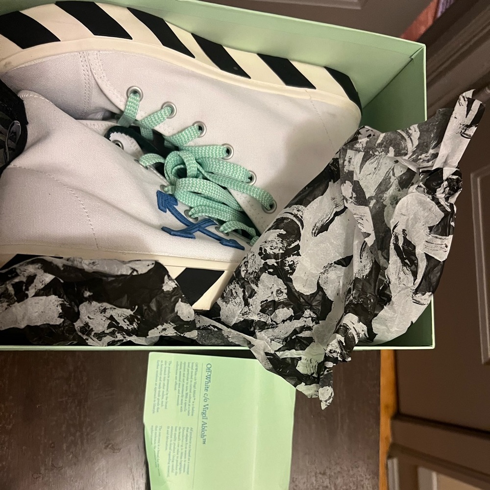 Authentic off white canvas sneakers , slightly worn size 11